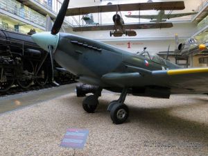 A Spitfire fighter and other aircraft in the museum's transportation hall.