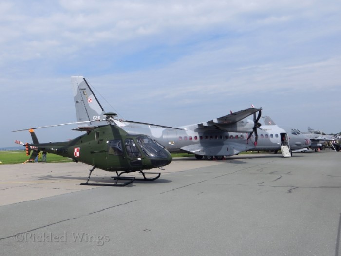 A PZL SW-4 helicopter, a CASA 295 transport and an F-16 fighter in from Poland.